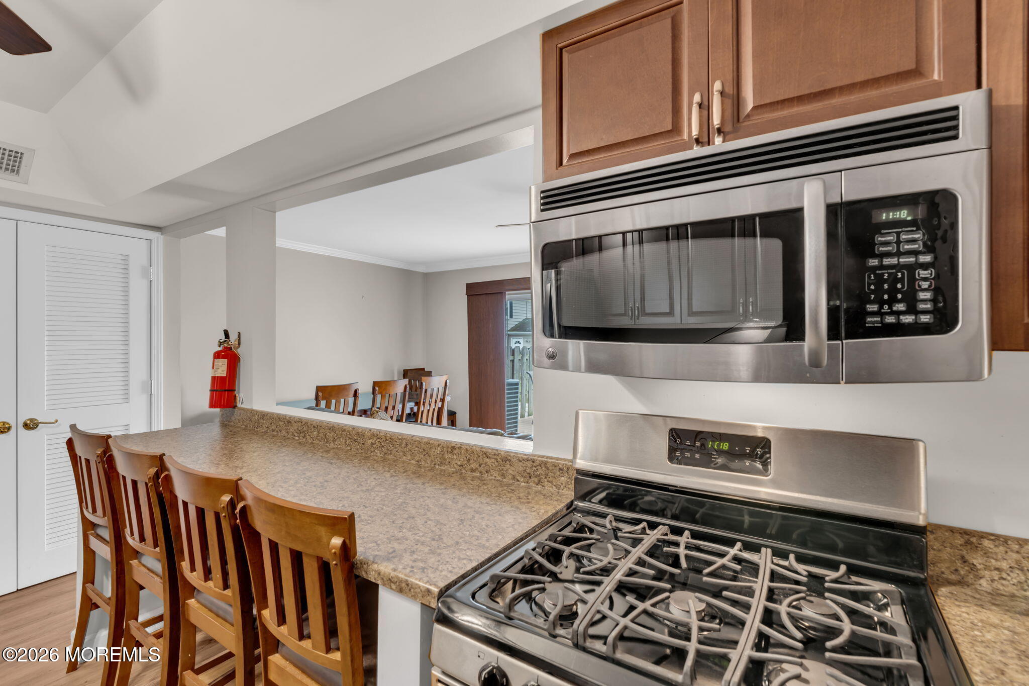 72 Kingsley Way Freehold, NJ 07728 - Photo 16 of 36 a kitchen with stainless steel appliances a stove a microwave a sink and cabinets