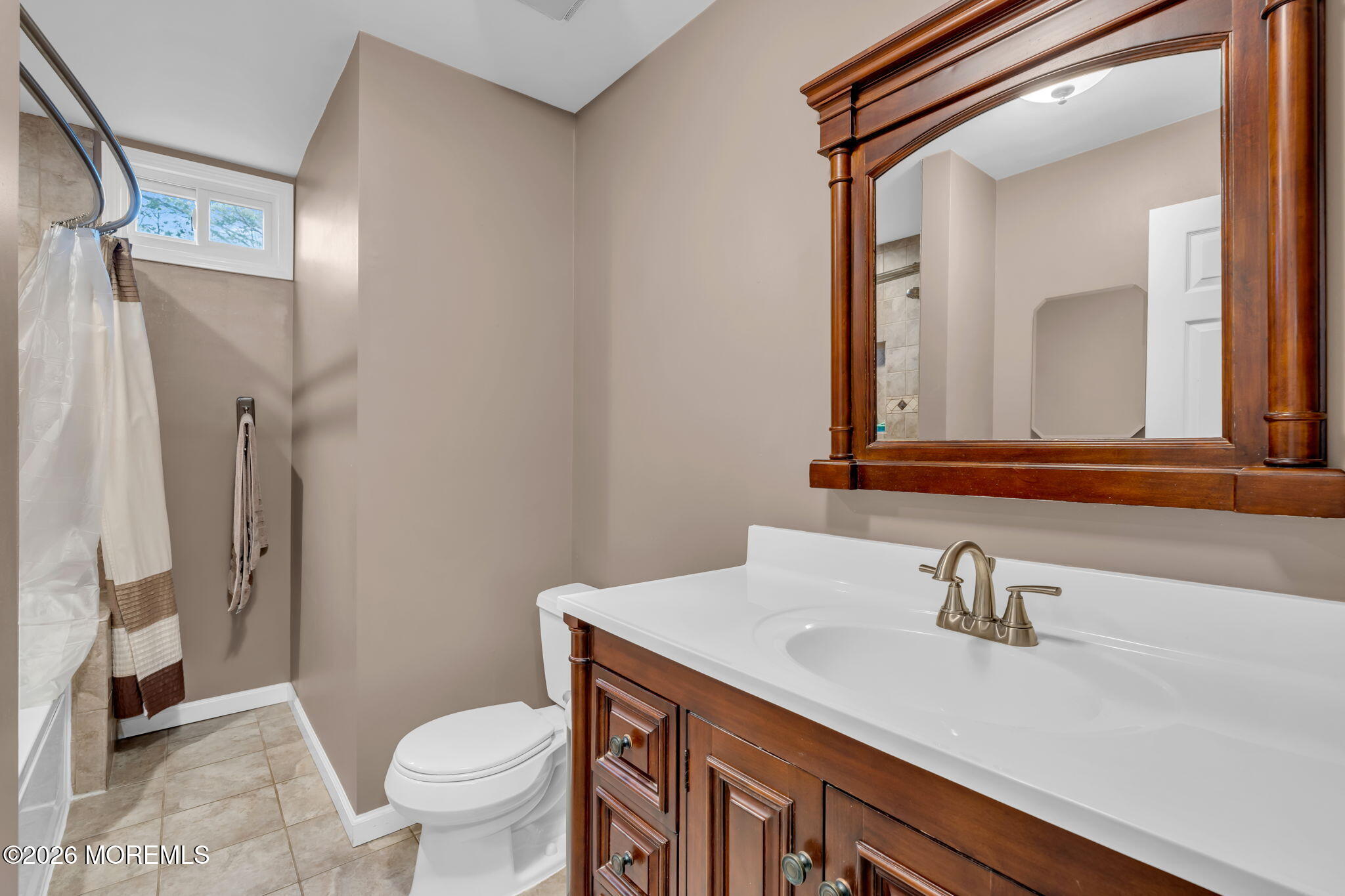72 Kingsley Way Freehold, NJ 07728 - Photo 22 of 36 a bathroom with a sink and a mirror
