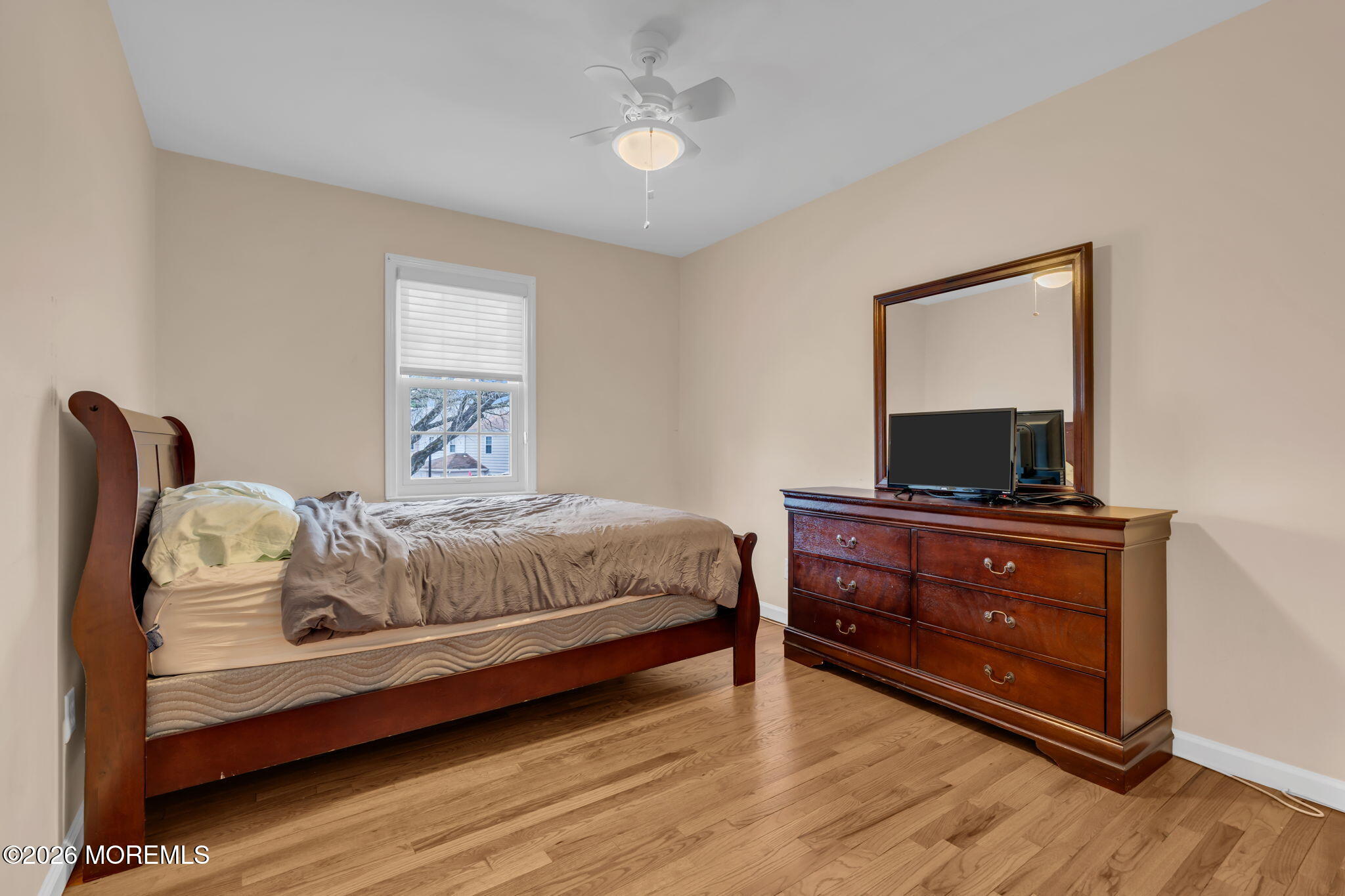 72 Kingsley Way Freehold, NJ 07728 - Photo 25 of 36 a bedroom with a bed and a flat screen tv