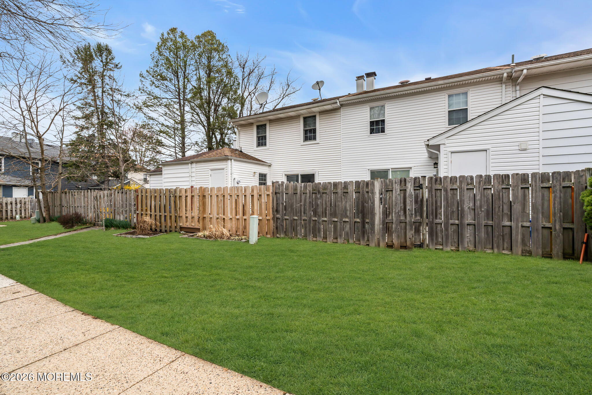 72 Kingsley Way Freehold, NJ 07728 - Photo 31 of 36 a view of a backyard with a garden