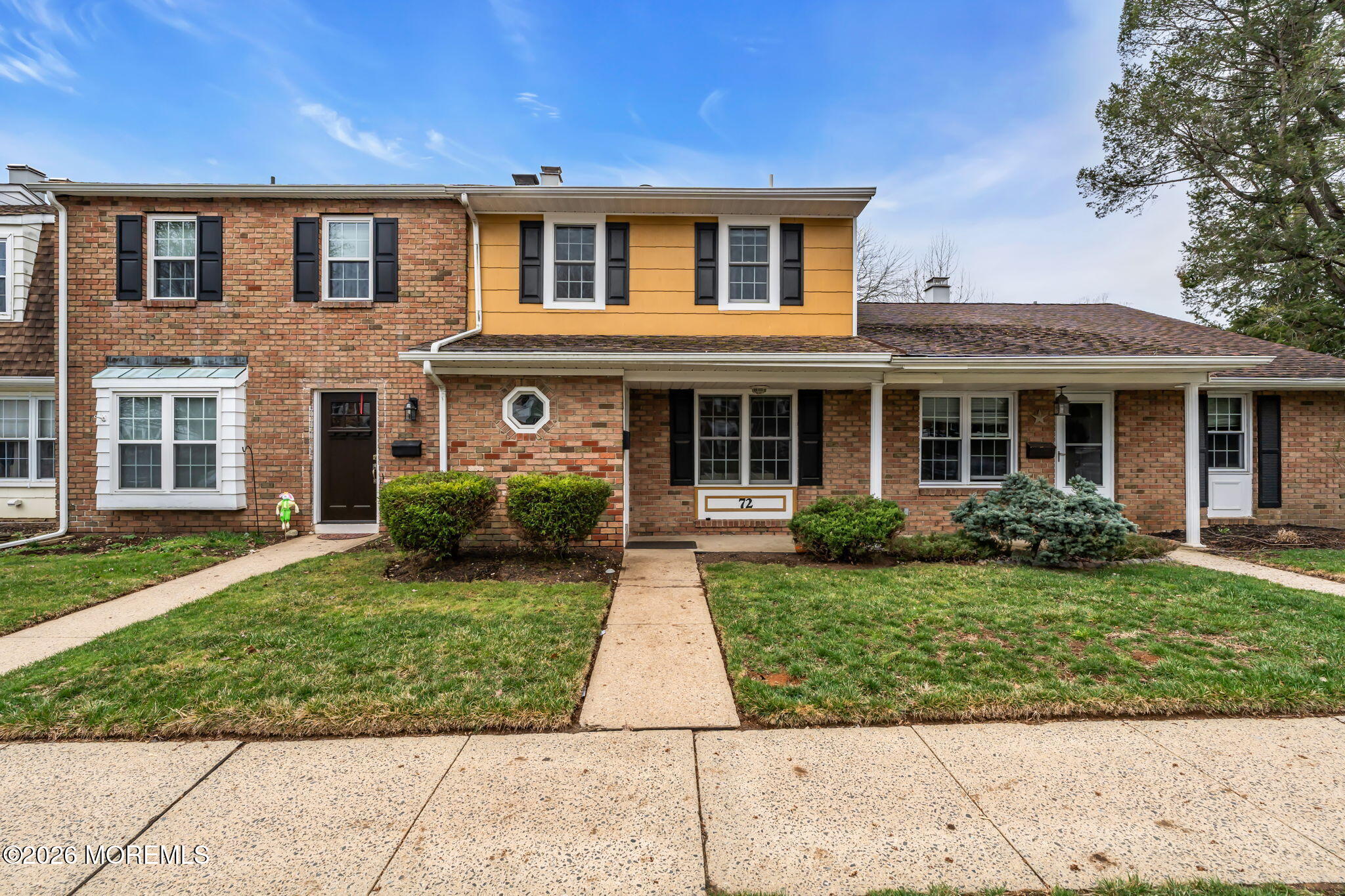 72 Kingsley Way Freehold, NJ 07728 - Photo 32 of 36 front view of a brick house with a yard