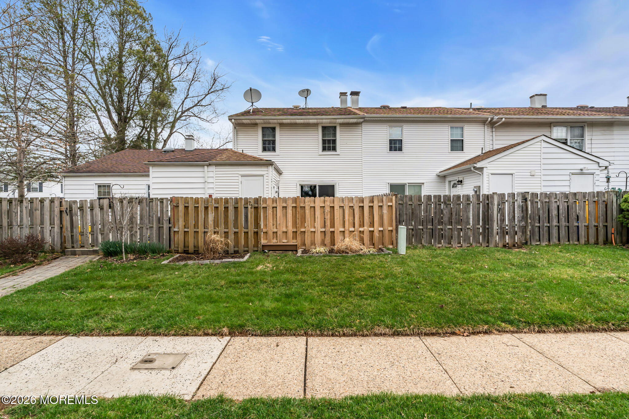 72 Kingsley Way Freehold, NJ 07728 - Photo 35 of 36 a view of a house with wooden fence