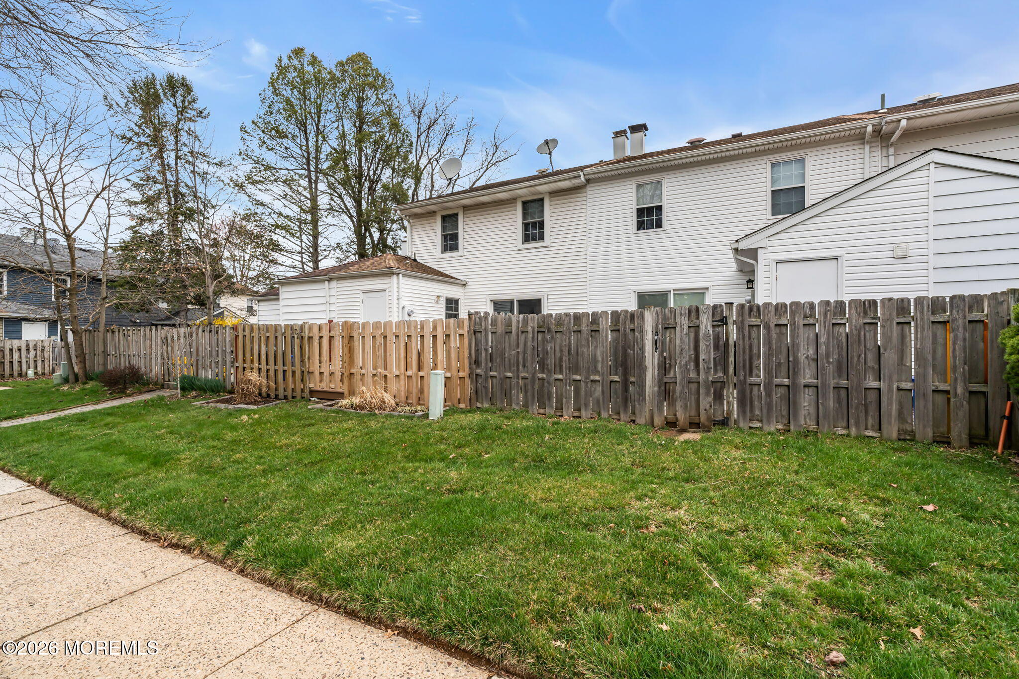 72 Kingsley Way Freehold, NJ 07728 - Photo 36 of 36 a view of a backyard with wooden fence