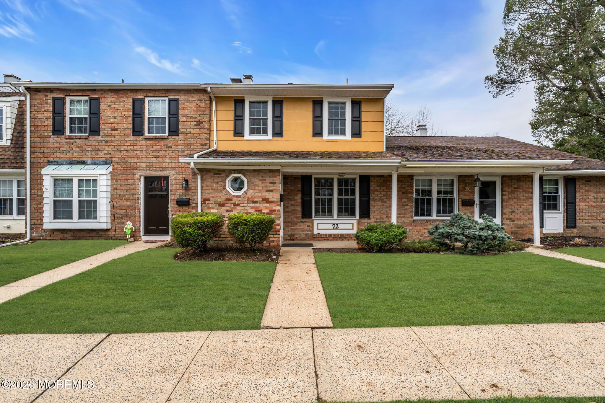 72 Kingsley Way Freehold, NJ 07728 - Photo 4 of 36 front view of a brick house with a yard