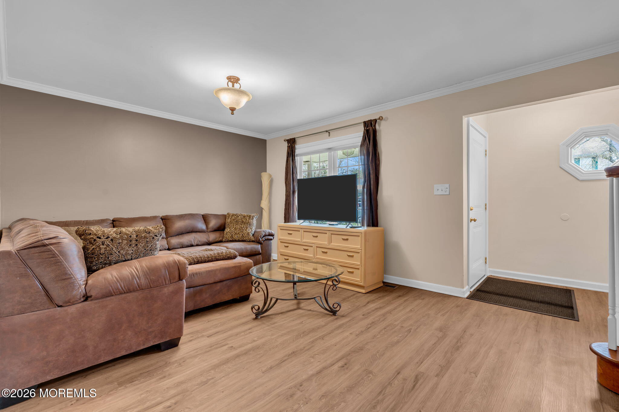 72 Kingsley Way Freehold, NJ 07728 - Photo 9 of 36 a living room with furniture and a chandelier