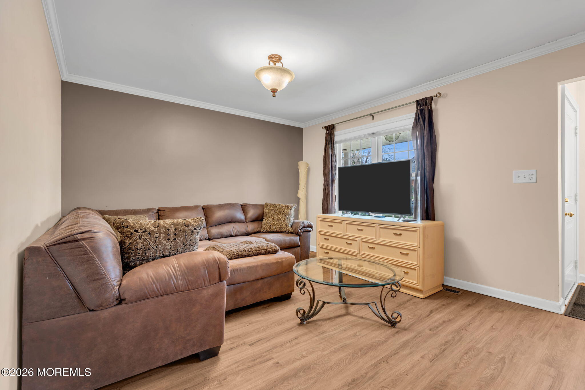 72 Kingsley Way Freehold, NJ 07728 - Photo 10 of 36 a living room with furniture and a flat screen tv