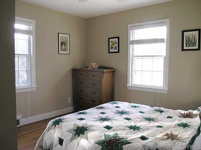 2719 Everett Avenue Raleigh, NC 27607 - Photo 6 of 10 a bedroom with a bed and a window