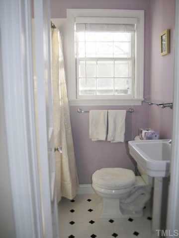2719 Everett Avenue Raleigh, NC 27607 - Photo 8 of 10 a bathroom with a sink a toilet and a window