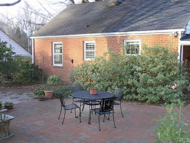2719 Everett Avenue Raleigh, NC 27607 - Photo 9 of 10 a view of a patio with table and chairs and potted plants