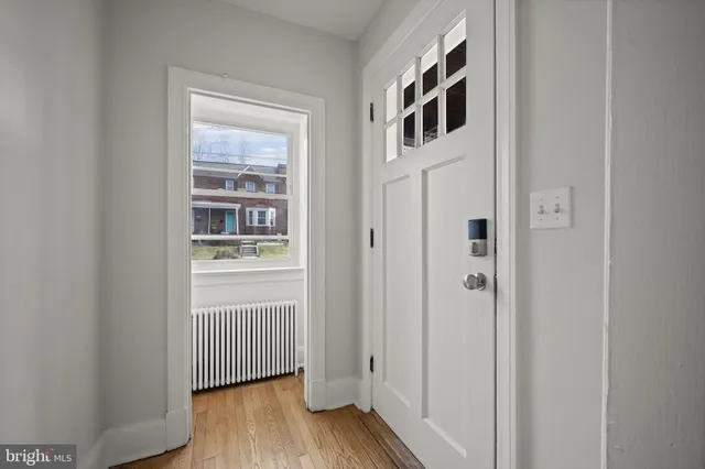 a view of front door with wooden floor