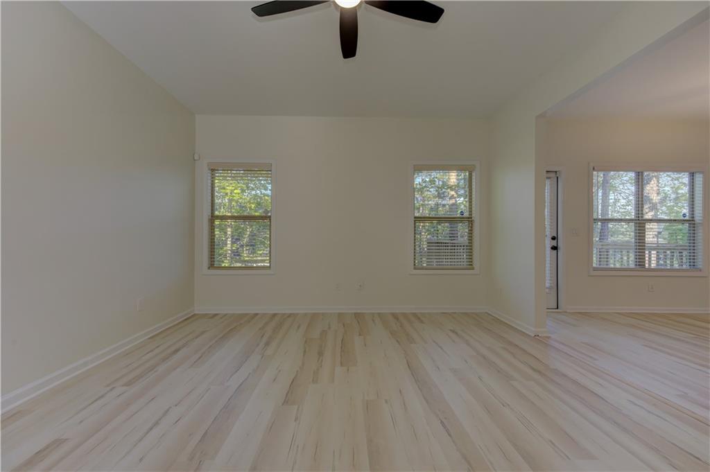 605 Summit Point Canton, GA 30114 - Photo 10 of 56 wooden floor in an empty room with a window