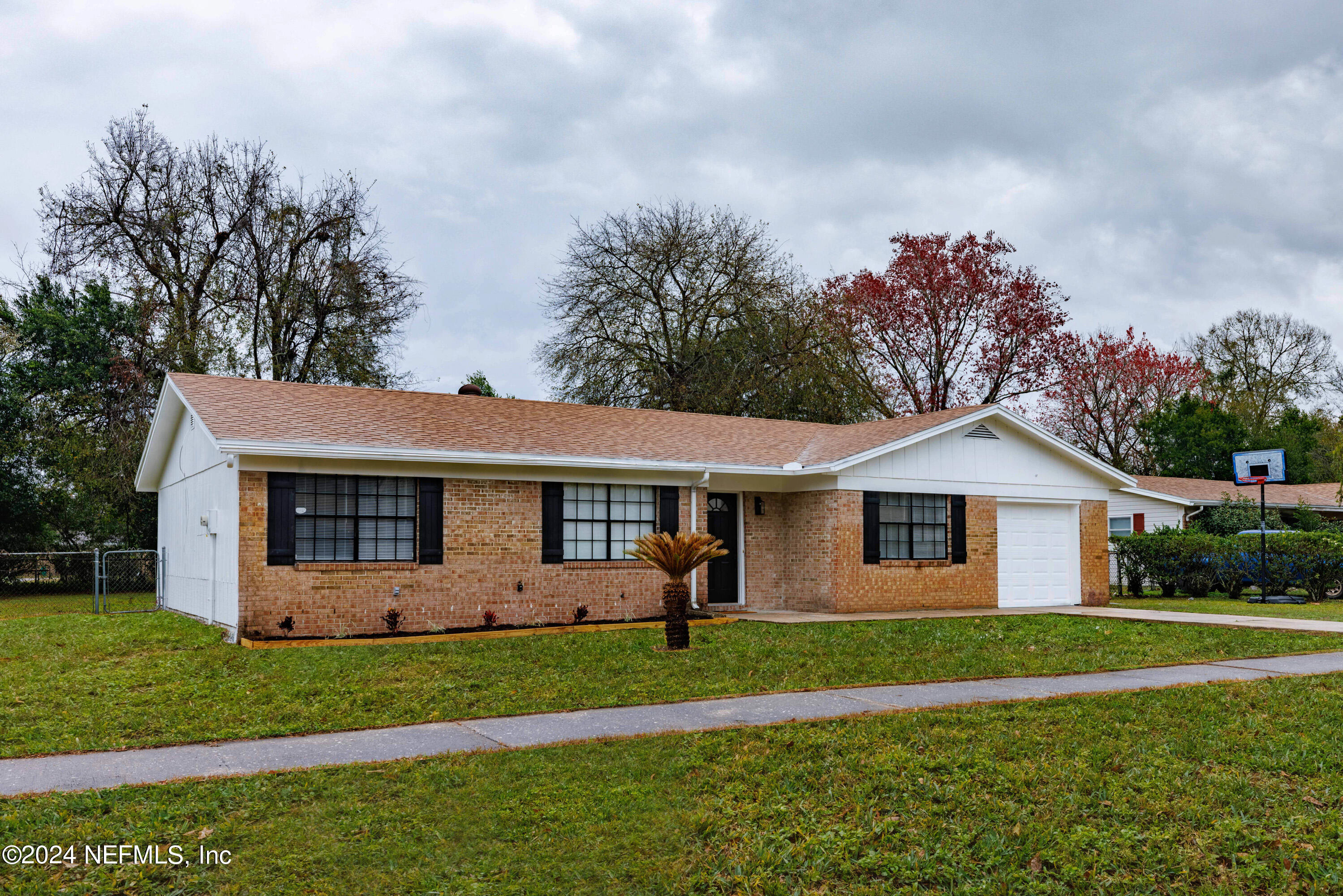 8225 Cassie Road Jacksonville, FL 32221 - Photo 2 of 22 a front view of house with yard and green space