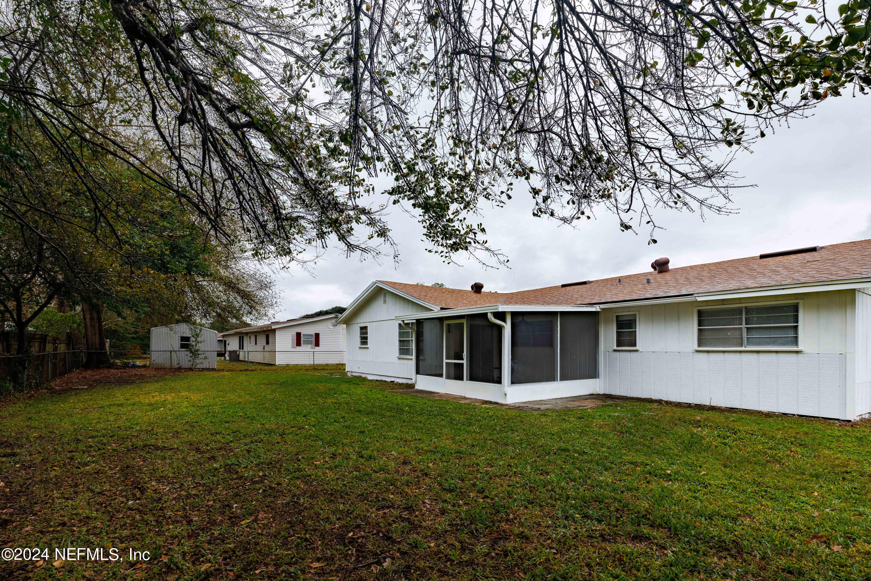 8225 Cassie Road Jacksonville, FL 32221 - Photo 5 of 22 a view of a house with a backyard