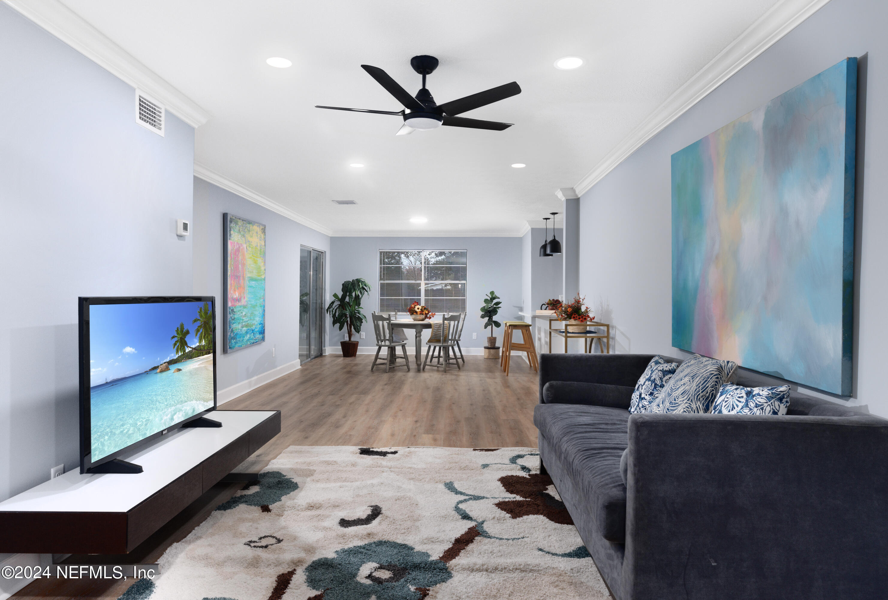 8225 Cassie Road Jacksonville, FL 32221 - Photo 8 of 22 a living room with furniture and a flat screen tv