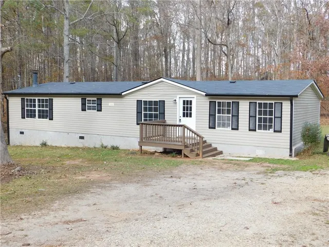 a house with trees in the background