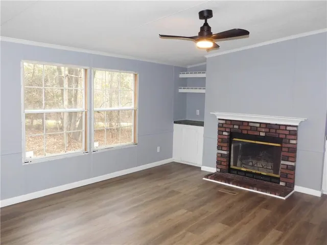 a living room with a fireplace and a window