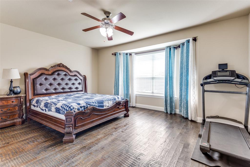 3716 Rumford Road Frisco, TX 75036 - Photo 12 of 25 a bedroom with a bed and a chandelier