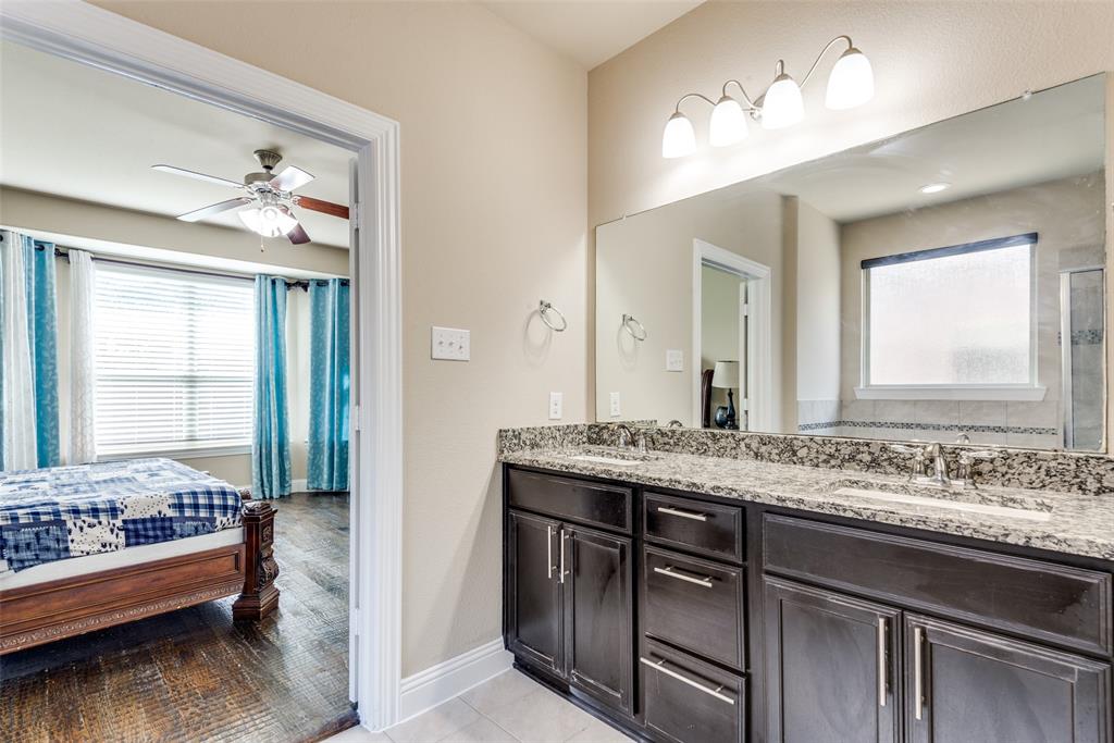 3716 Rumford Road Frisco, TX 75036 - Photo 13 of 25 a en suite bathroom with a granite countertop sink and a mirror