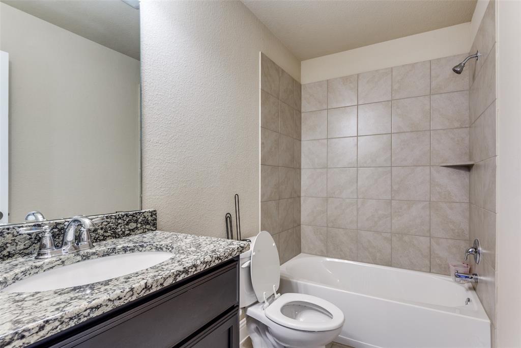 3716 Rumford Road Frisco, TX 75036 - Photo 16 of 25 a bathroom with a granite countertop bathtub sink vanity mirror and toilet