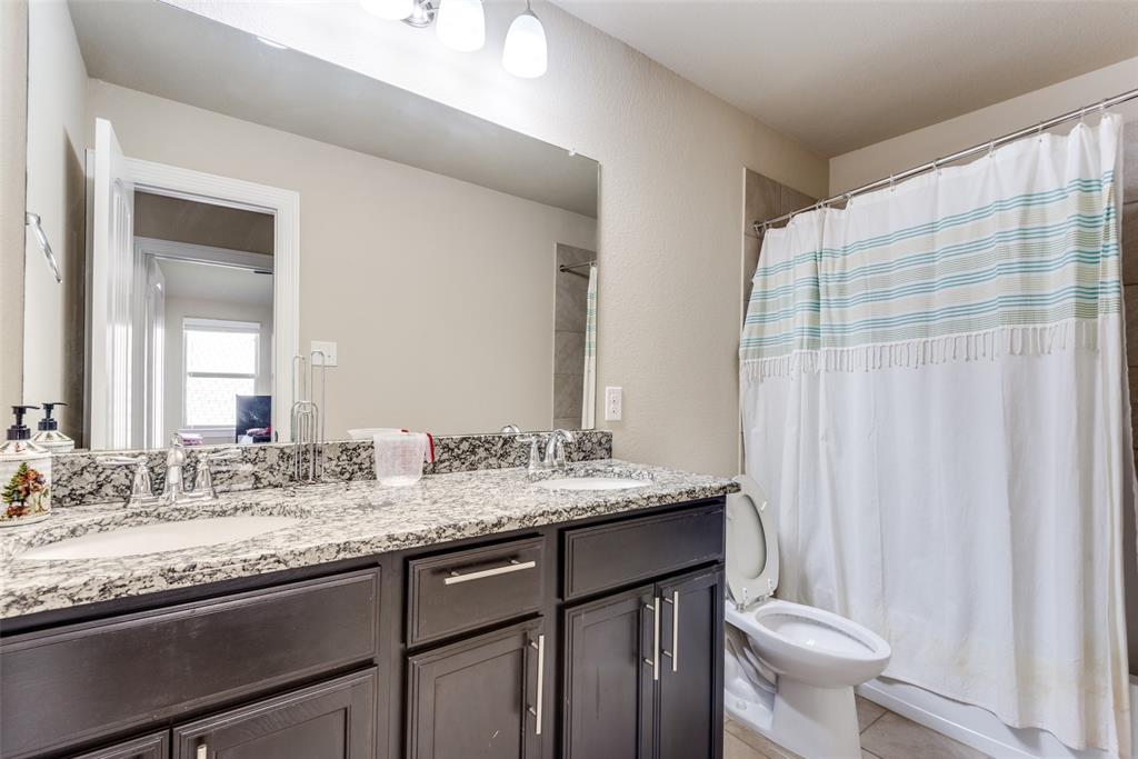 3716 Rumford Road Frisco, TX 75036 - Photo 18 of 25 a bathroom with a granite countertop sink and a mirror
