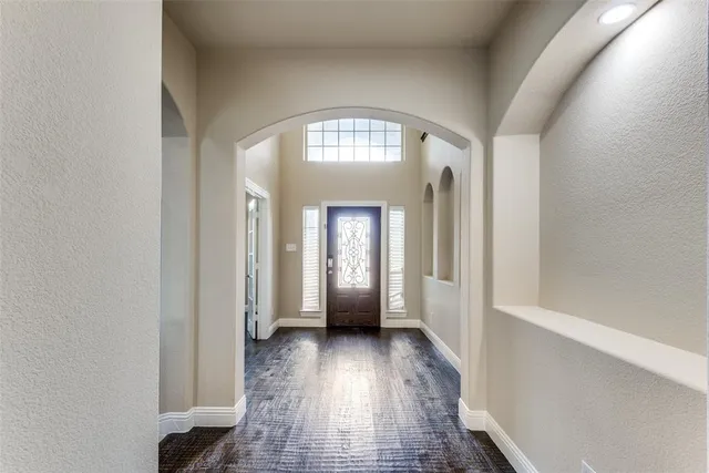wooden floor in a hall with a mirror