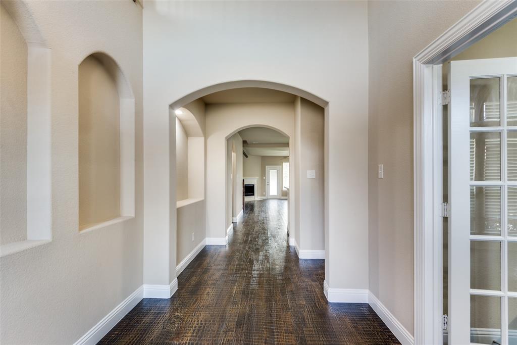 3716 Rumford Road Frisco, TX 75036 - Photo 4 of 25 a view of a hallway with wooden floor and staircase