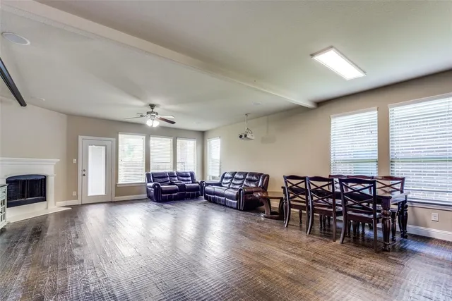 a view of a livingroom with furniture window and wooden floor