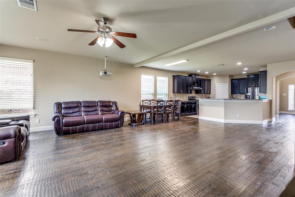 3716 Rumford Road Frisco, TX 75036 - Photo 7 of 25 a living room with furniture wooden floor and a kitchen