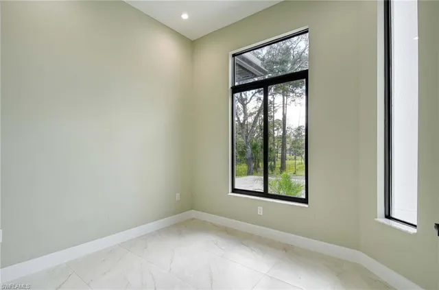 an empty room with windows