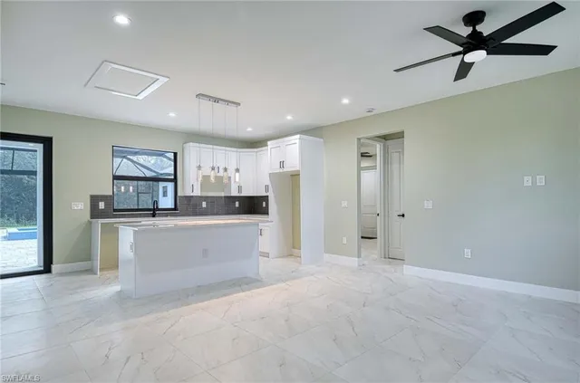 a view of kitchen with stainless steel appliances refrigerator oven