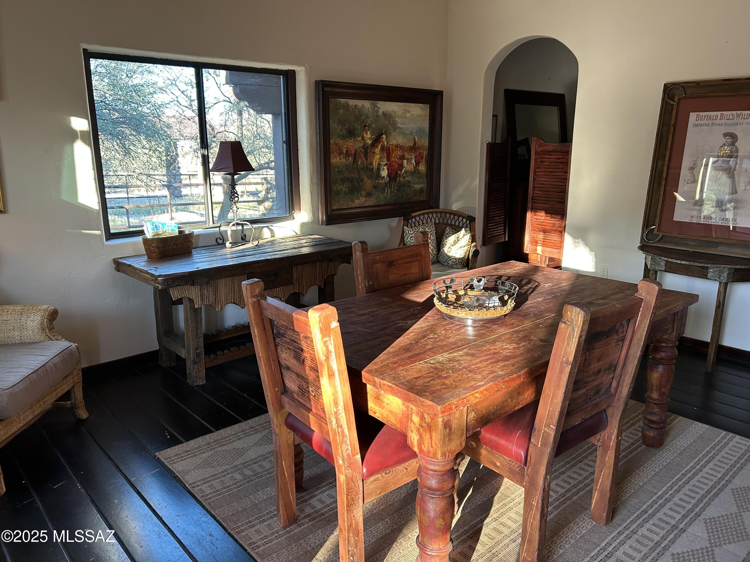 1265 Morning Star Drive Rio Rico, AZ 85648 - Photo 32 of 50 a dining room with furniture a rug and wooden floor