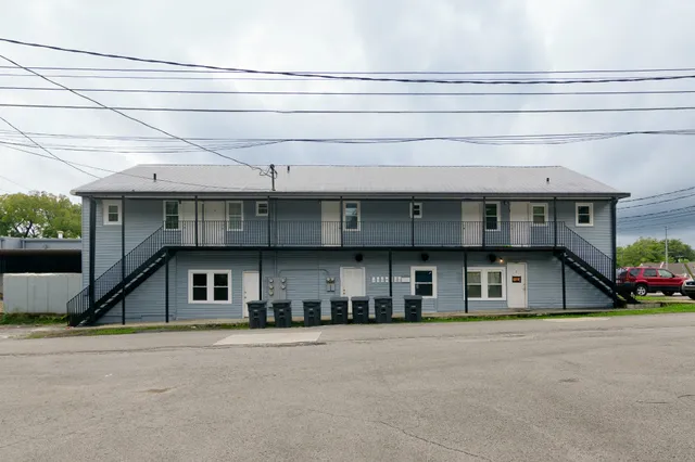a view of a house with a street