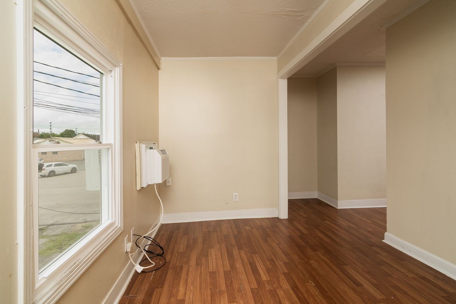 206 Edison Street West Fayetteville, TN 37334 - Photo 8 of 9 an empty room with wooden floor and windows