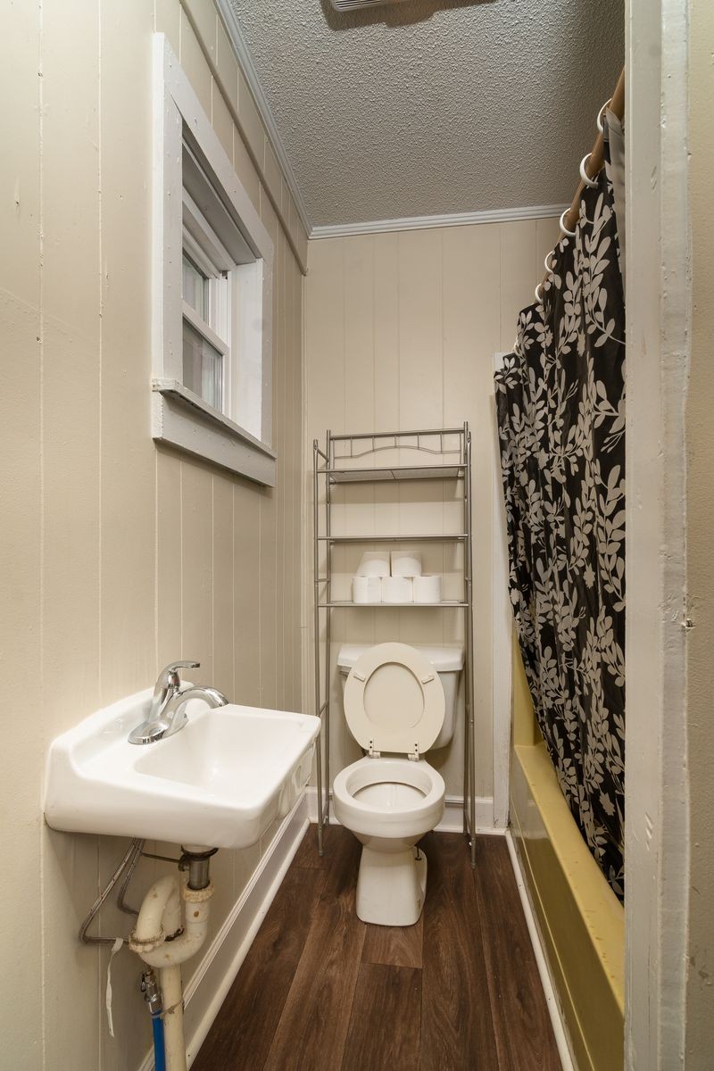 206 Edison Street West Fayetteville, TN 37334 - Photo 9 of 9 a bathroom with a sink toilet and shower
