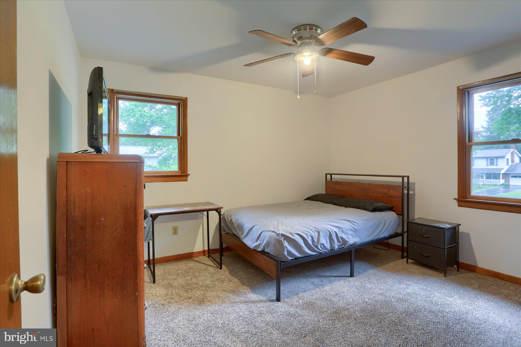 12 South Ridge Road Boiling Springs, PA 17007 - Photo 23 of 39 a bedroom with a bed and a chandelier