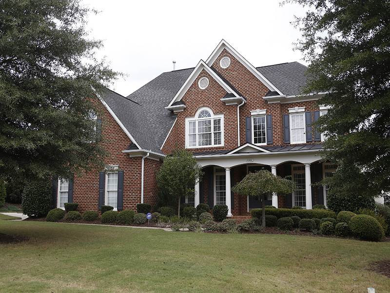 2001 Falls Farm Crossing Raleigh, NC 27614 - Photo 1 of 14 Maintenance free 3-sided brick transitional with a 3rd garage for that sports car! Exterior Front