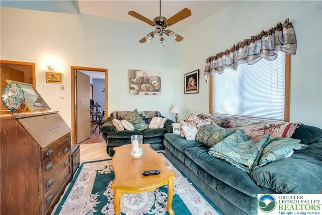 a living room with furniture and a table