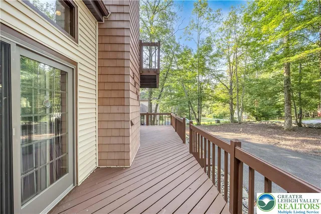 a view of a balcony with wooden floor