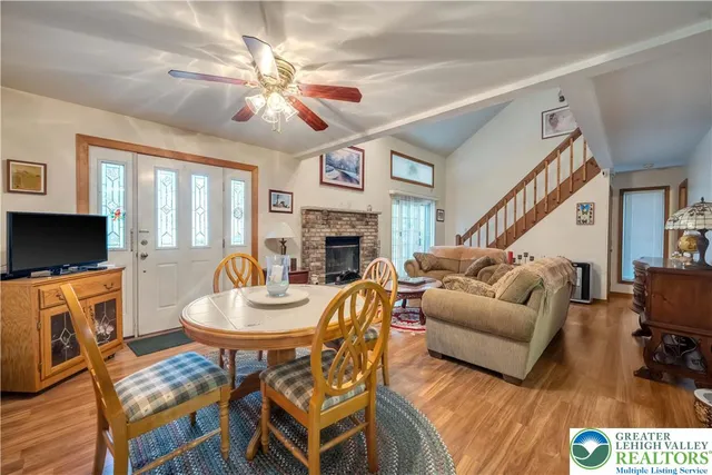 a living room with fireplace furniture and a flat screen tv