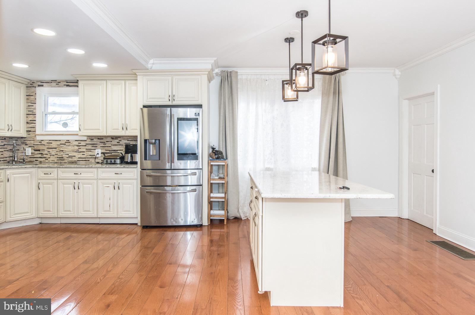 7400 Claridge Street Philadelphia, PA 19111 - Photo 11 of 43 a kitchen with stainless steel appliances a stove top oven and cabinets
