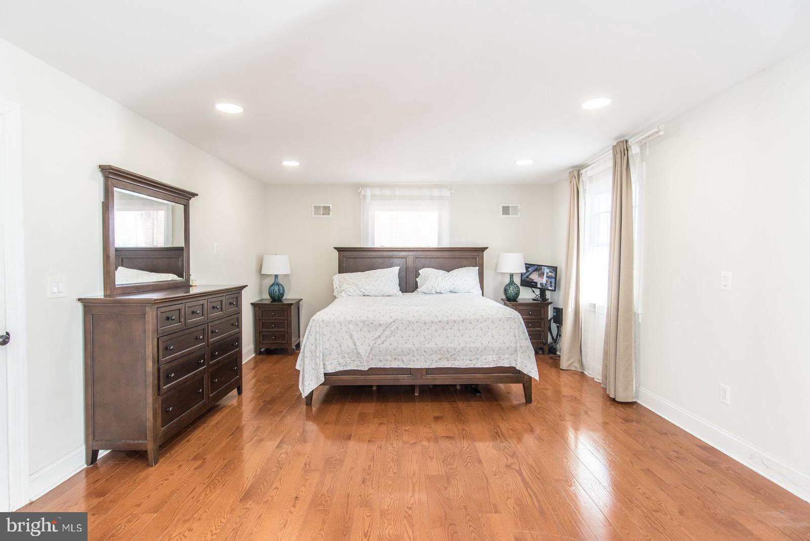 7400 Claridge Street Philadelphia, PA 19111 - Photo 16 of 43 a bedroom with a bed and a flat screen tv