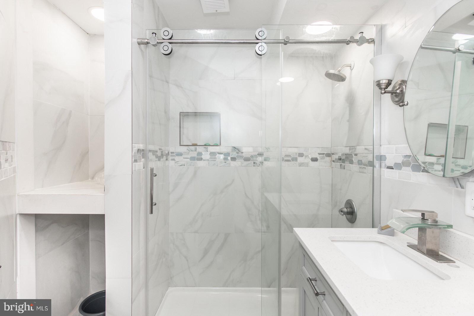 7400 Claridge Street Philadelphia, PA 19111 - Photo 21 of 43 a bathroom with a sink shower and a mirror