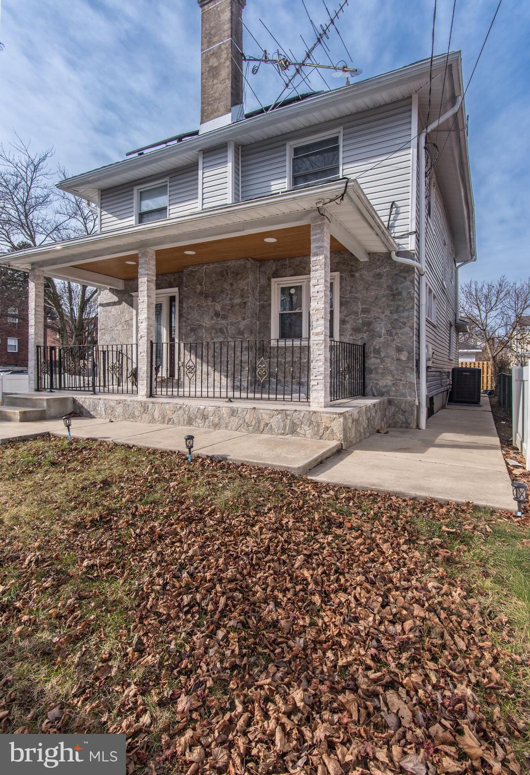 7400 Claridge Street Philadelphia, PA 19111 - Photo 3 of 43 a front view of a building with a garden