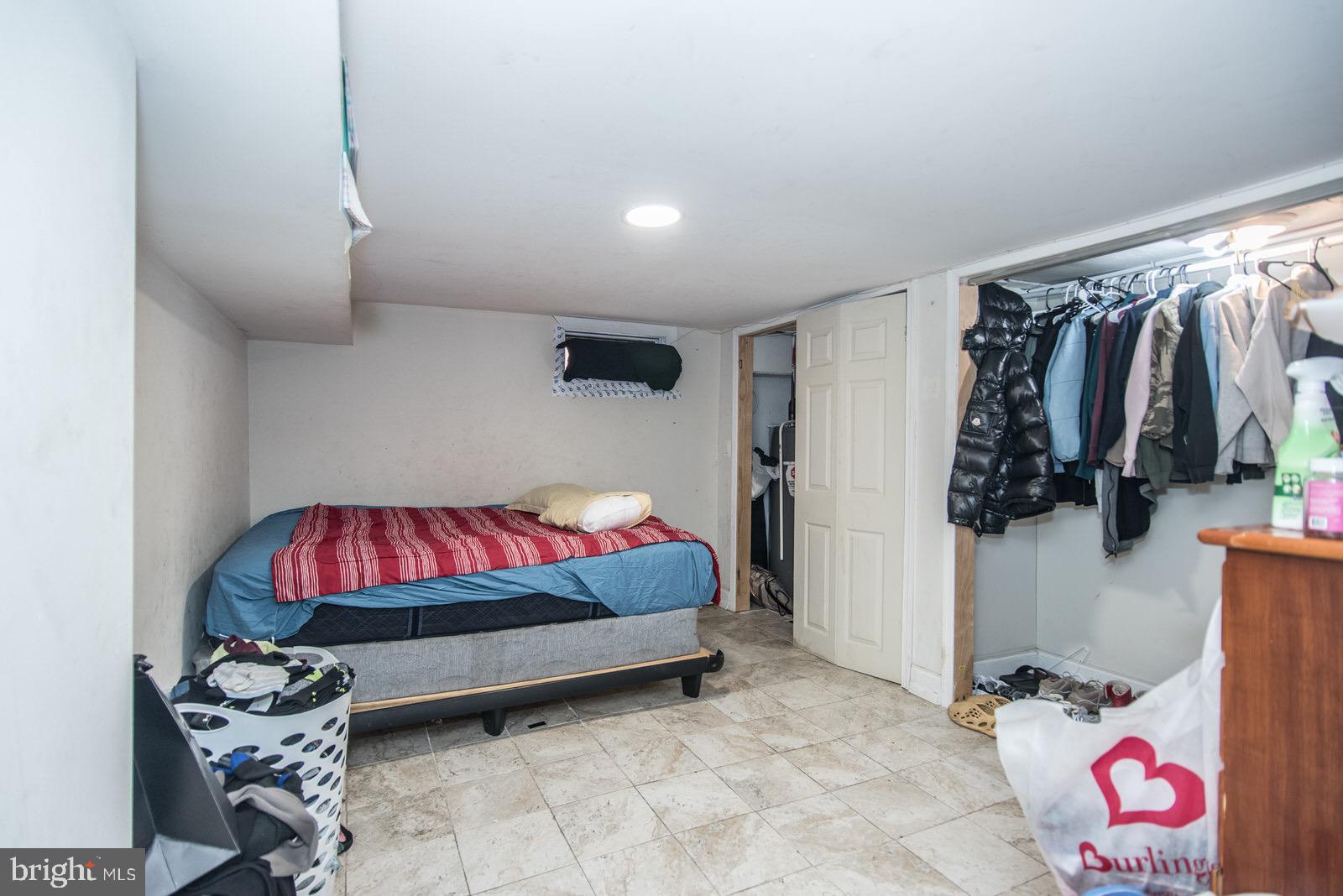 7400 Claridge Street Philadelphia, PA 19111 - Photo 37 of 43 a bedroom with a bed and a couch