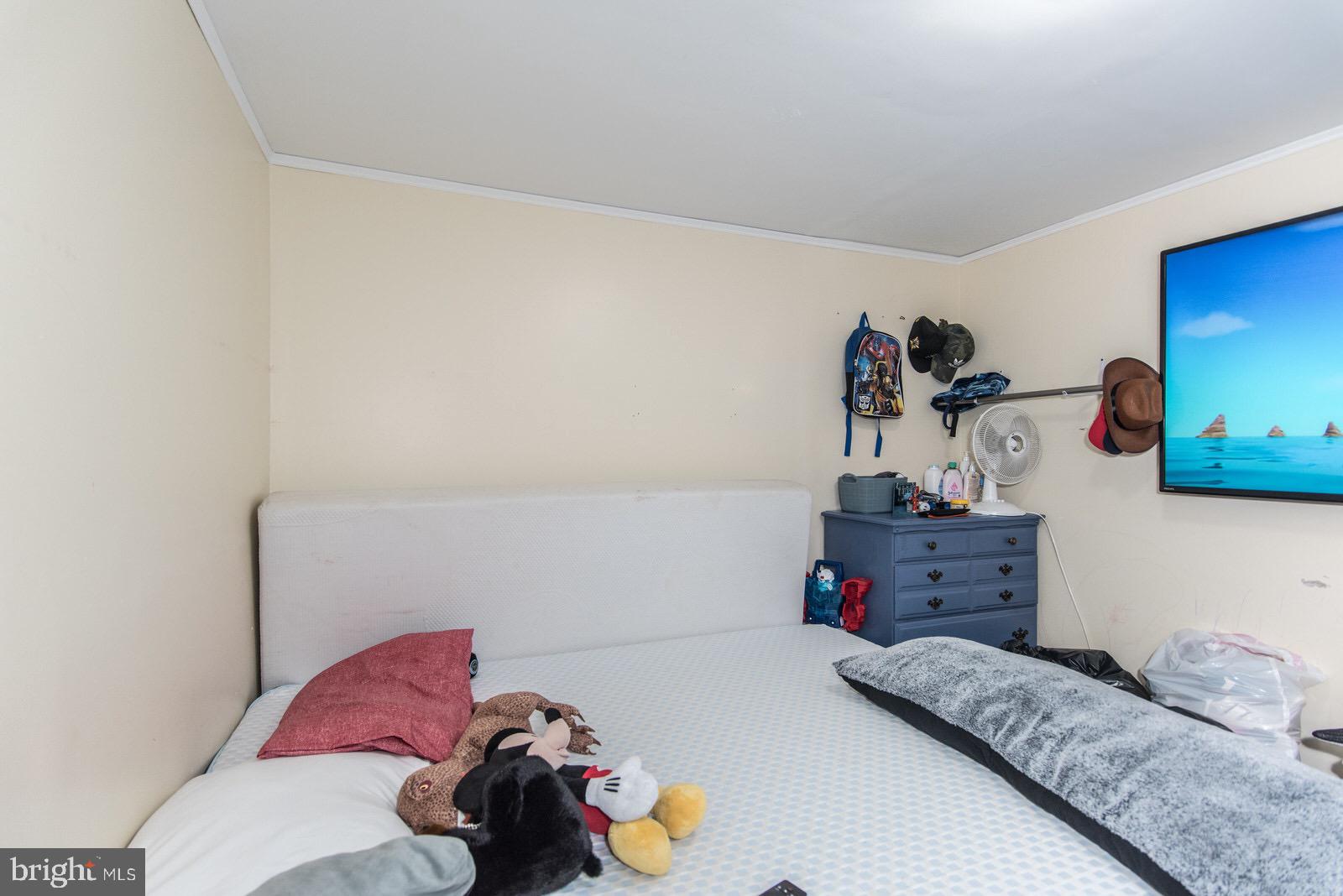 7400 Claridge Street Philadelphia, PA 19111 - Photo 39 of 43 a bedroom with a bed and cabinets