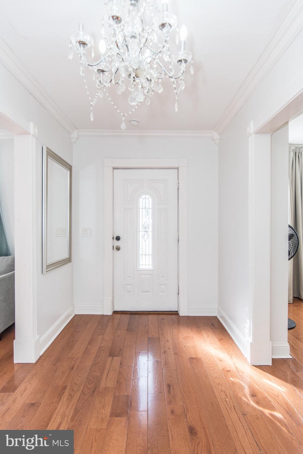 7400 Claridge Street Philadelphia, PA 19111 - Photo 4 of 43 an empty room with wooden floor and windows