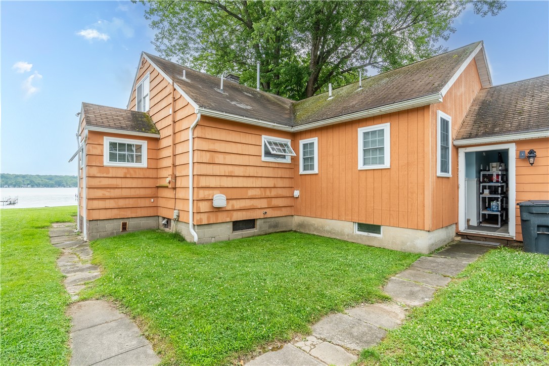 3533 Pebble Beach Road Livonia, NY 14480 - Photo 2 of 25 Rear entry into garage , sidewalk winding around t