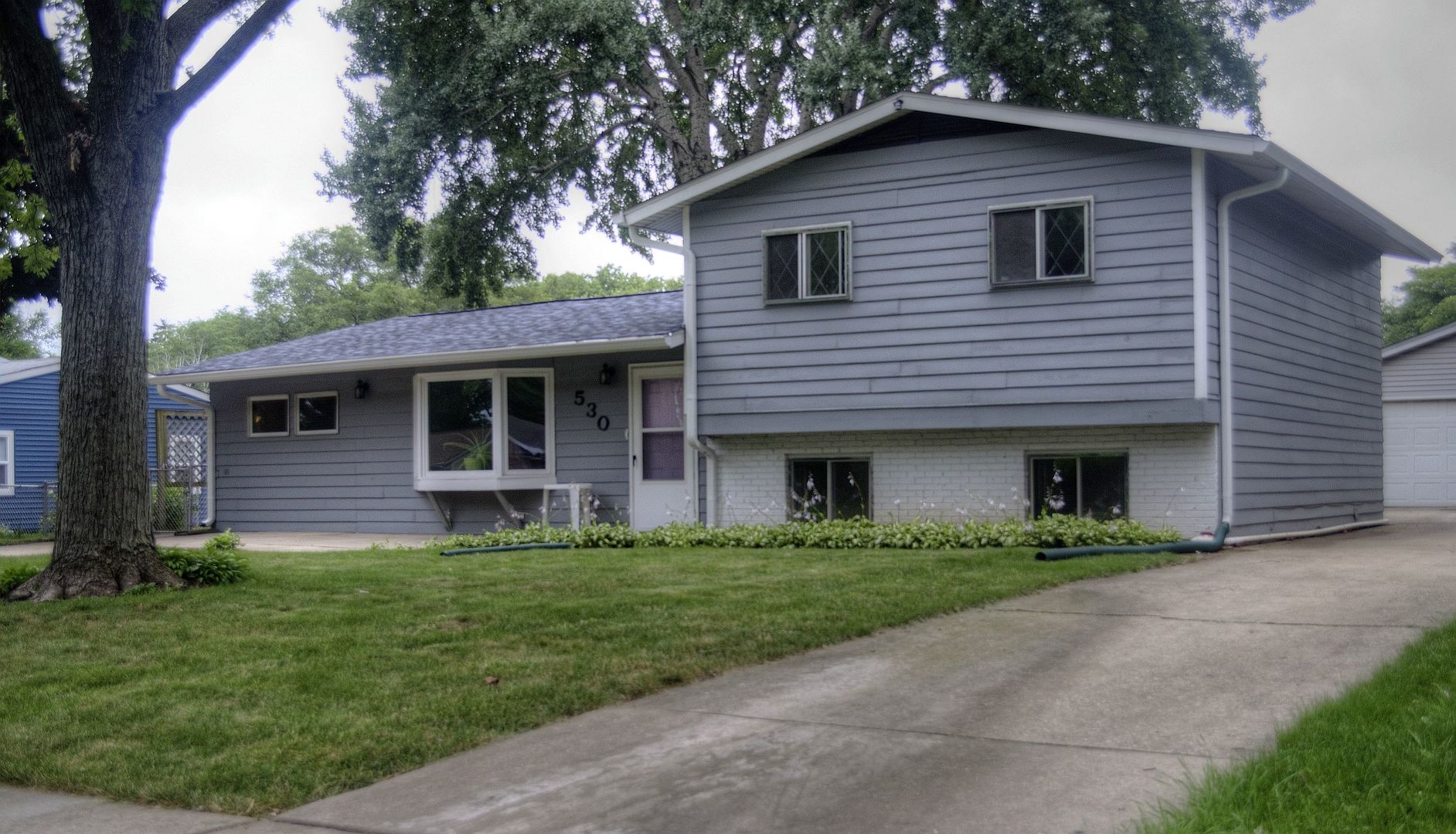 530 Redwood Road Bolingbrook, IL 60440 - Photo 1 of 33 a front view of a house with a garden