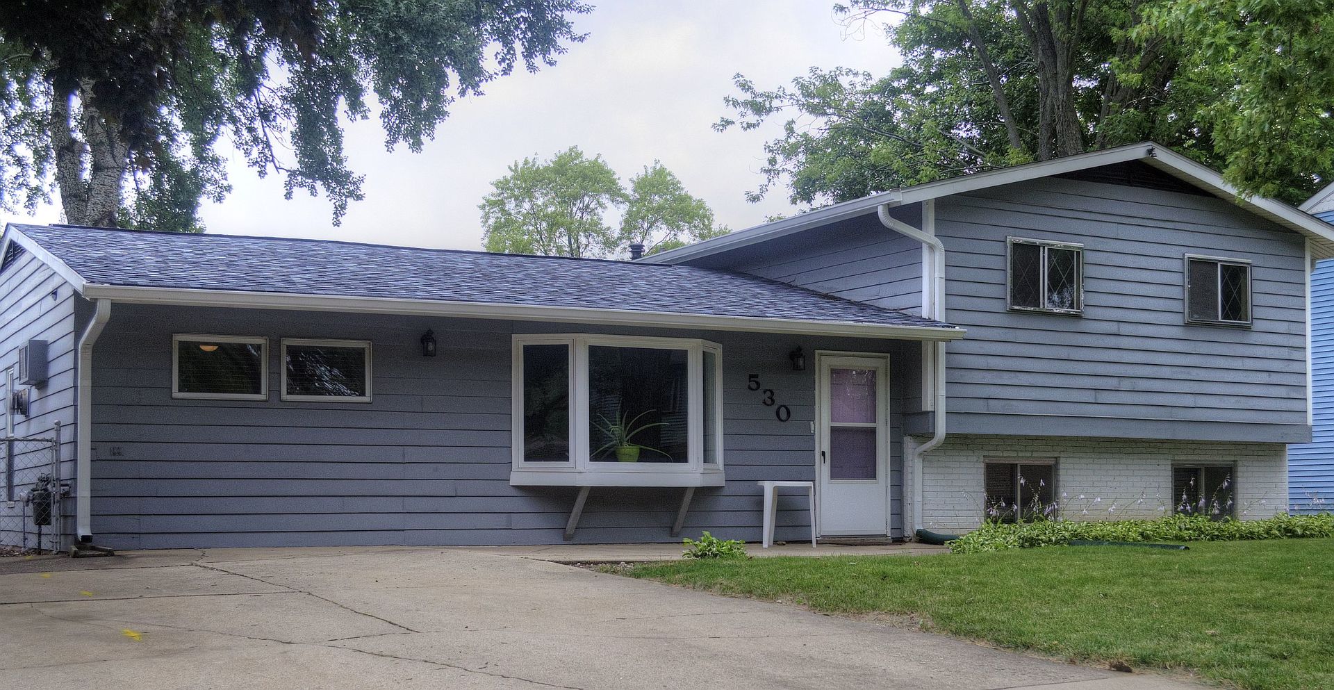 530 Redwood Road Bolingbrook, IL 60440 - Photo 2 of 33 a view of a house with a yard plants and large tree
