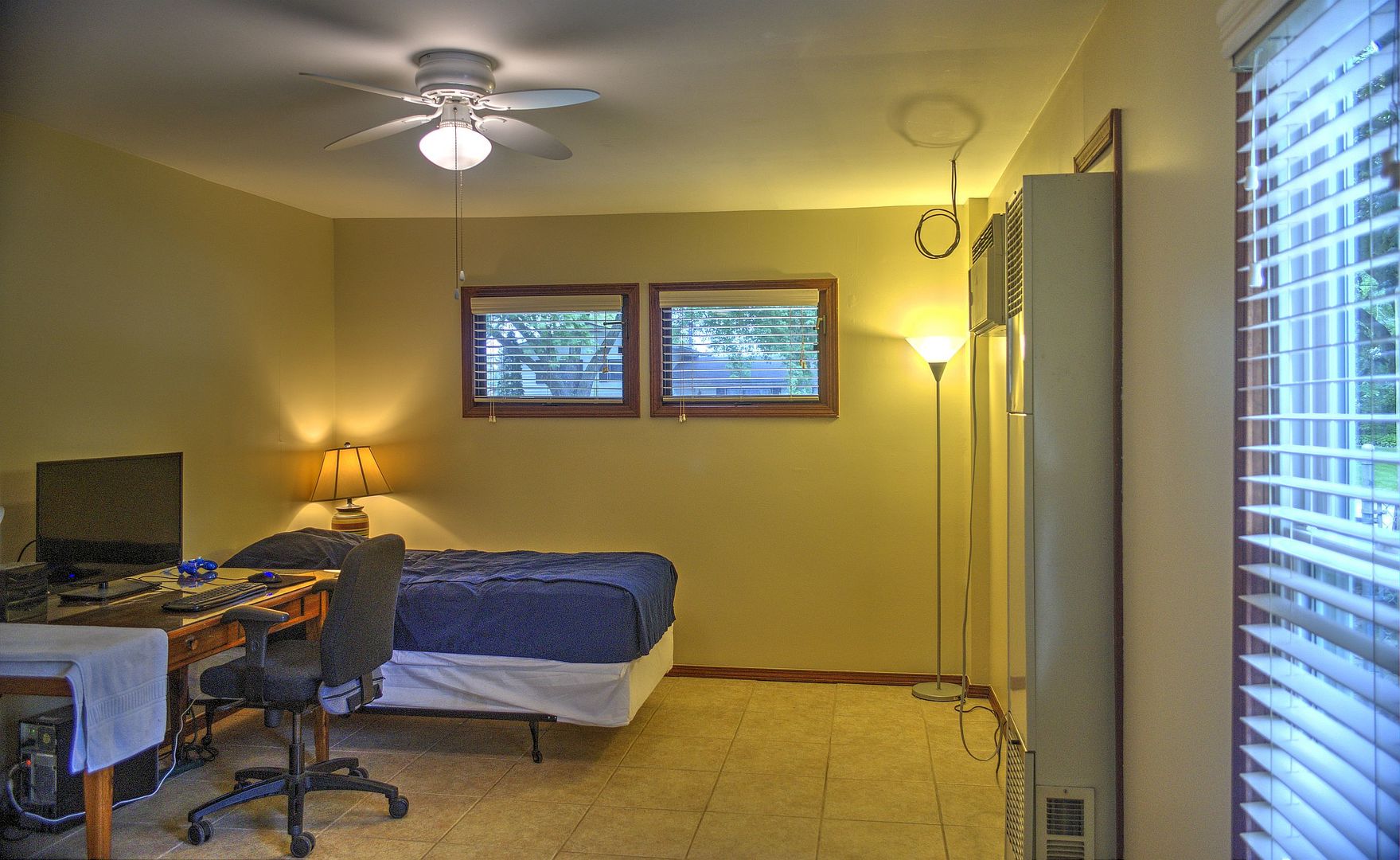 530 Redwood Road Bolingbrook, IL 60440 - Photo 10 of 33 a view of a workspace with furniture and a ceiling fan